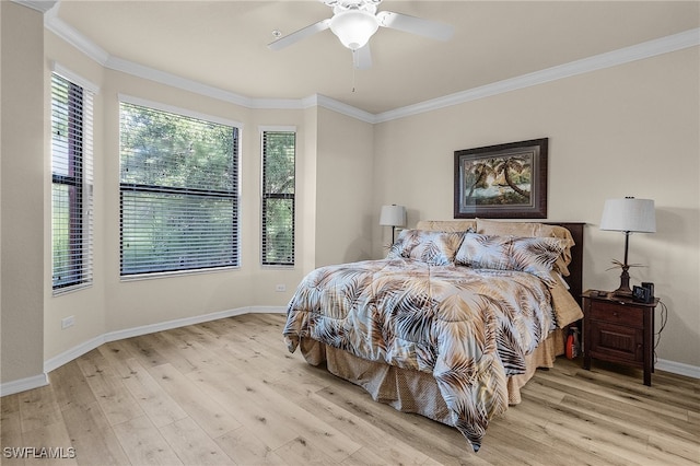 bedroom with multiple windows, crown molding, light hardwood / wood-style floors, and ceiling fan