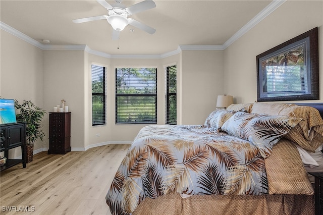 bedroom featuring multiple windows, crown molding, ceiling fan, and light hardwood / wood-style flooring