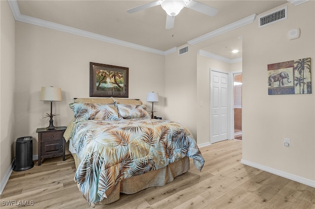 bedroom featuring ceiling fan, a closet, crown molding, and light hardwood / wood-style floors