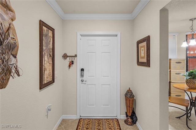 entryway with light tile patterned flooring and ornamental molding