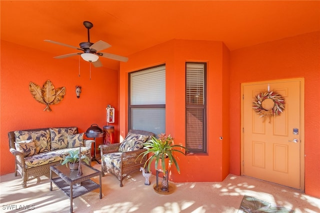 doorway to property with a patio and ceiling fan