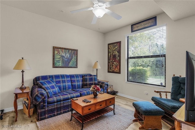 living room featuring hardwood / wood-style floors and ceiling fan