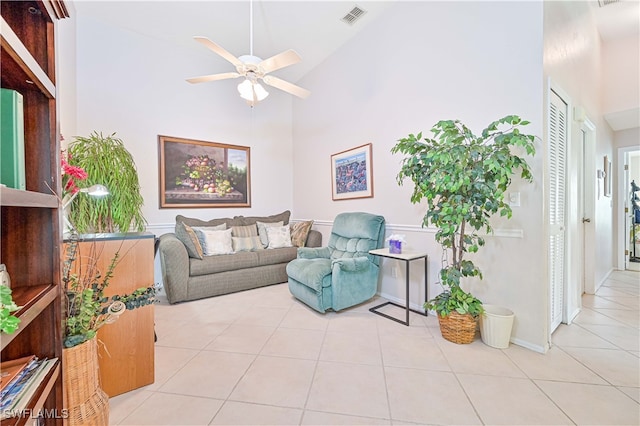 living room with light tile patterned flooring, high vaulted ceiling, and ceiling fan