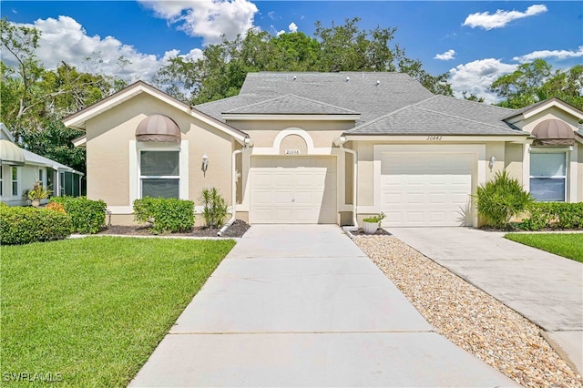 view of front facade featuring a garage and a front yard