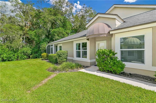 view of property exterior with a yard