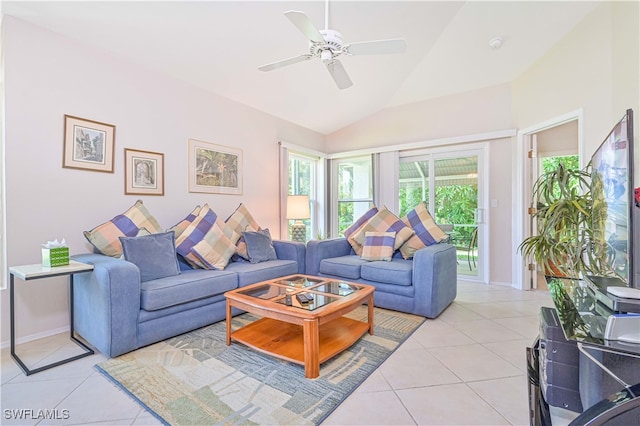 tiled living room featuring ceiling fan and vaulted ceiling