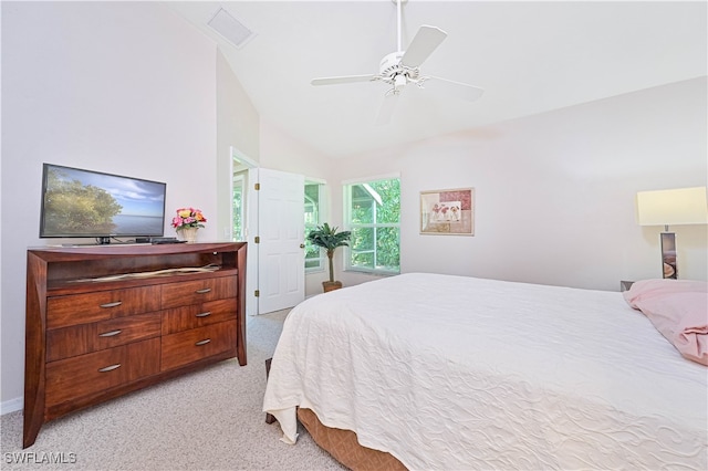 carpeted bedroom featuring high vaulted ceiling and ceiling fan