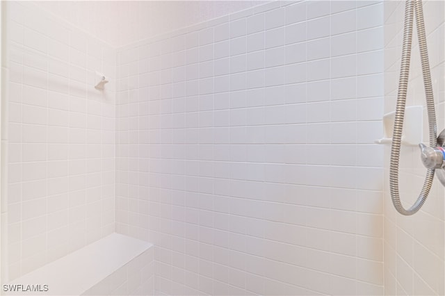 bathroom with a tile shower