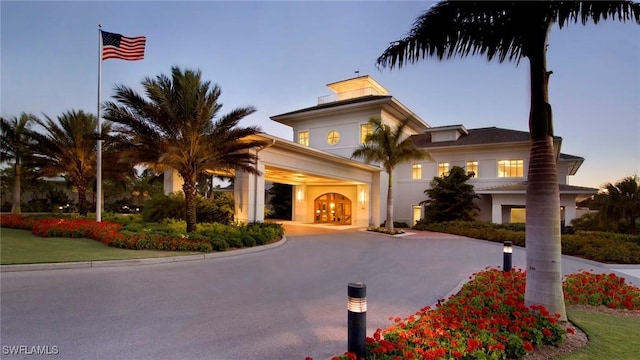 outdoor building at dusk featuring french doors