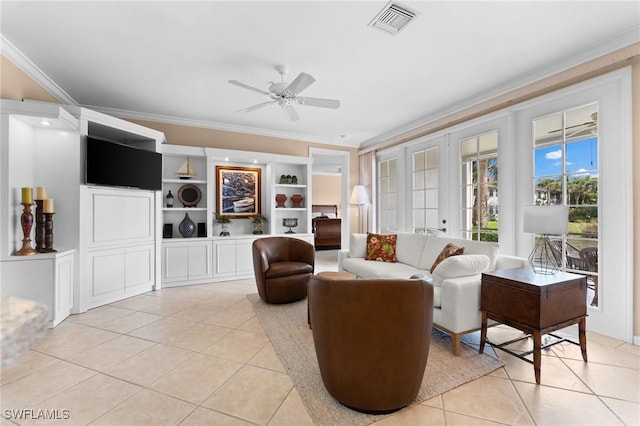 sitting room with light tile patterned flooring, ceiling fan, and ornamental molding