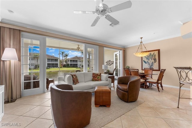 living room featuring crown molding, light tile patterned floors, and ceiling fan