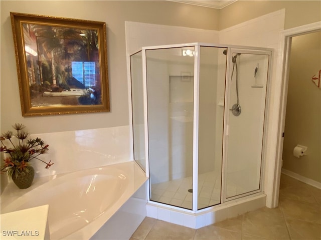 bathroom featuring plus walk in shower and tile patterned flooring