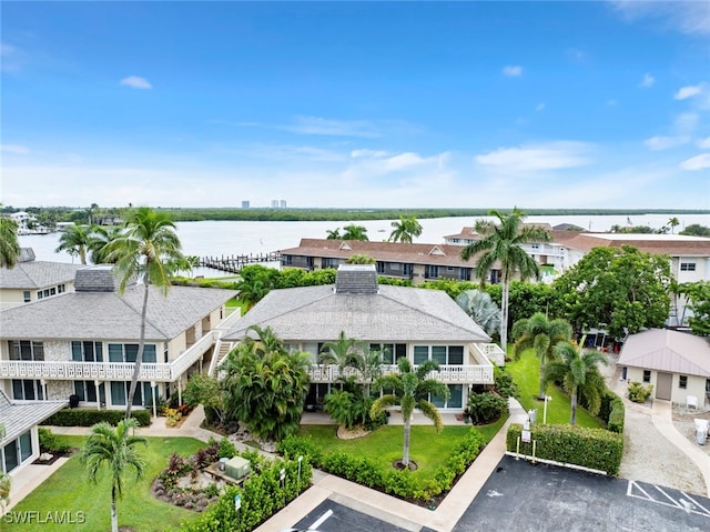 birds eye view of property featuring a water view