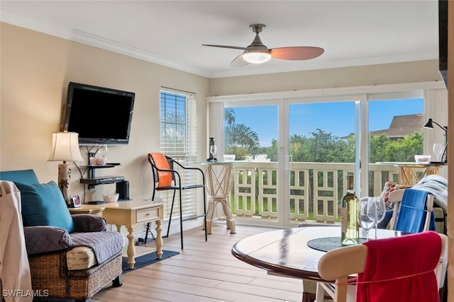 sunroom featuring ceiling fan