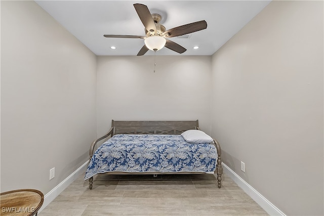 bedroom with ceiling fan and light wood-type flooring