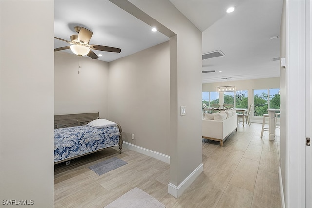 bedroom featuring light hardwood / wood-style floors and ceiling fan