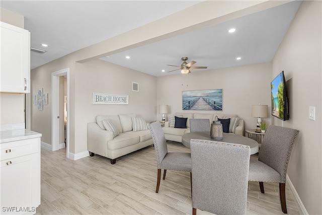 dining area featuring ceiling fan and light hardwood / wood-style floors