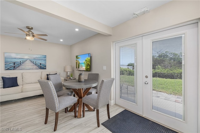 dining room featuring ceiling fan, beamed ceiling, french doors, and light hardwood / wood-style floors