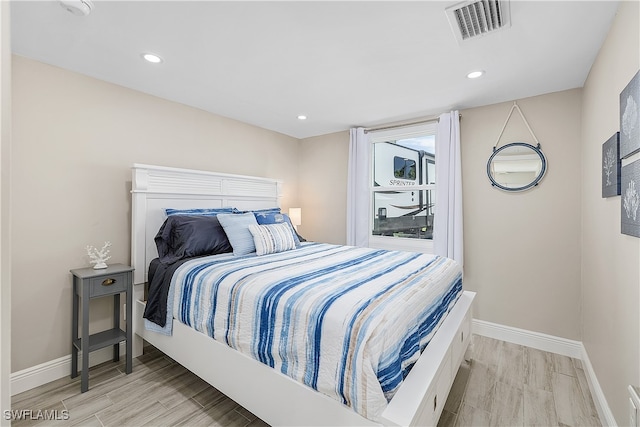 bedroom with light wood-type flooring