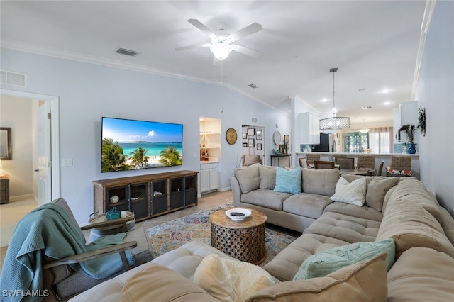 living room featuring ornamental molding, lofted ceiling, light tile patterned floors, and ceiling fan