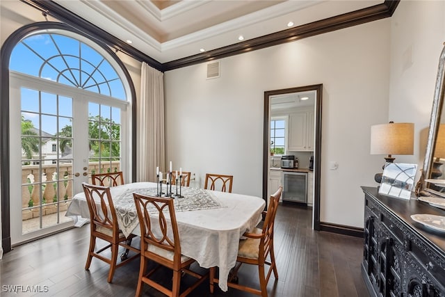 dining space featuring ornamental molding, french doors, dark hardwood / wood-style flooring, and beverage cooler