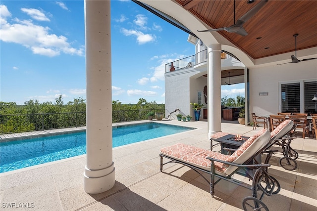 view of pool featuring ceiling fan and a patio