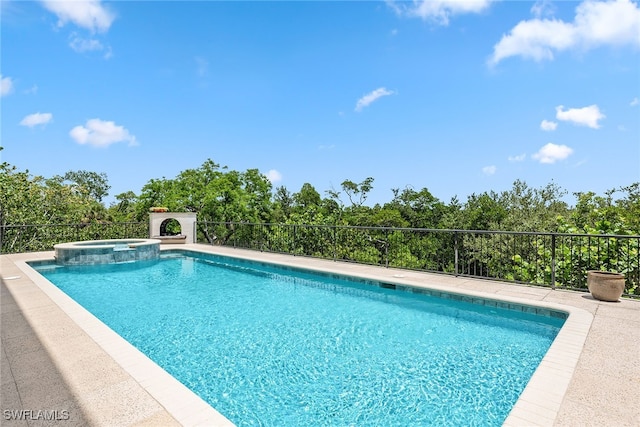 view of swimming pool featuring an in ground hot tub