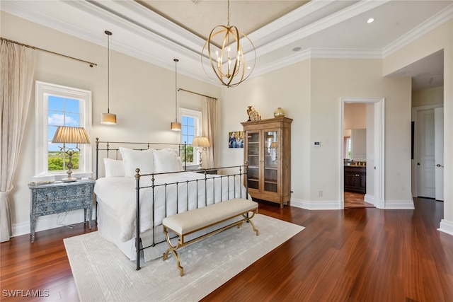 bedroom featuring dark hardwood / wood-style floors, connected bathroom, a notable chandelier, and ornamental molding