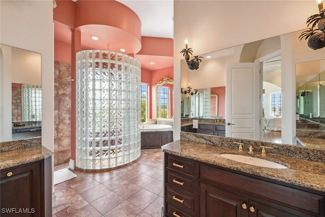 bathroom featuring vanity and separate shower and tub