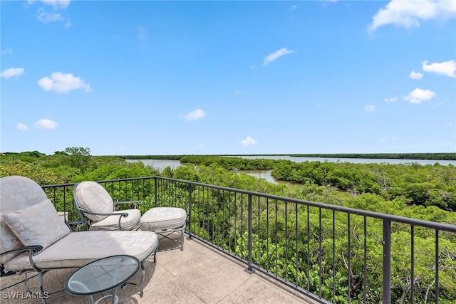 balcony featuring a water view