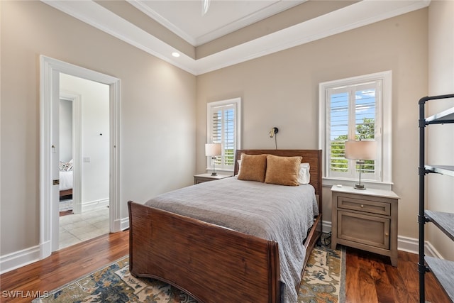 bedroom featuring ornamental molding and dark hardwood / wood-style floors