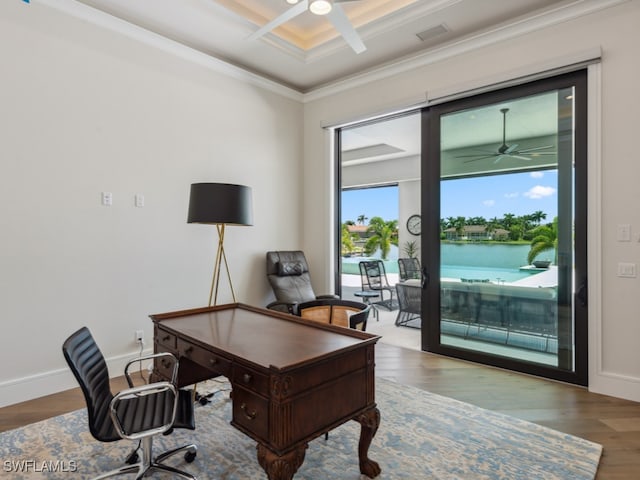 home office with ceiling fan, coffered ceiling, crown molding, hardwood / wood-style floors, and a water view