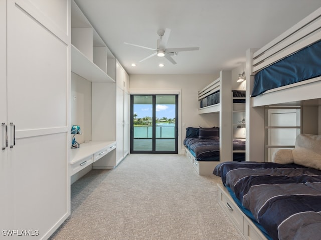 bedroom with light carpet, ceiling fan, and access to exterior