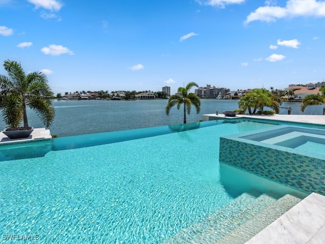 view of pool featuring a water view