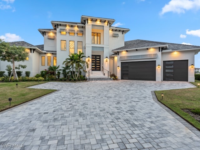 view of front facade featuring a garage and a front yard