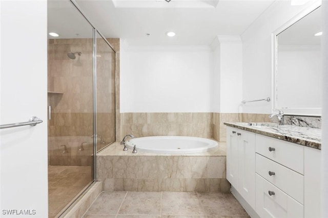 bathroom featuring crown molding, recessed lighting, a stall shower, vanity, and a bath