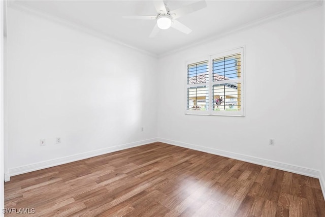 unfurnished room featuring baseboards, wood finished floors, a ceiling fan, and crown molding