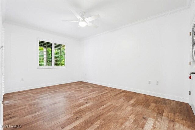 unfurnished room with crown molding, light wood-type flooring, and ceiling fan