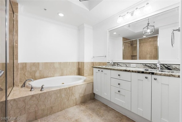 full bath featuring double vanity, ornamental molding, a sink, a shower stall, and a bath