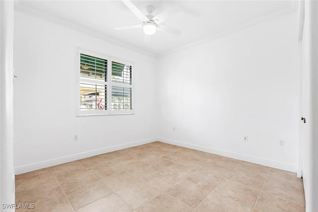 unfurnished room featuring ornamental molding, a ceiling fan, and baseboards