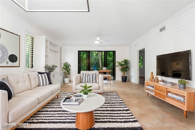 1035 Sandpiper St Unit F101, Naples, FL 34102 - living room featuring visible vents, crown molding, ceiling fan, and light tile patterned floors