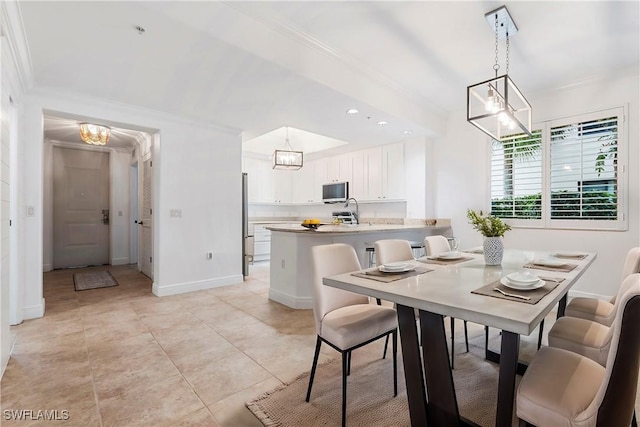 dining room with baseboards, light tile patterned flooring, crown molding, a chandelier, and recessed lighting