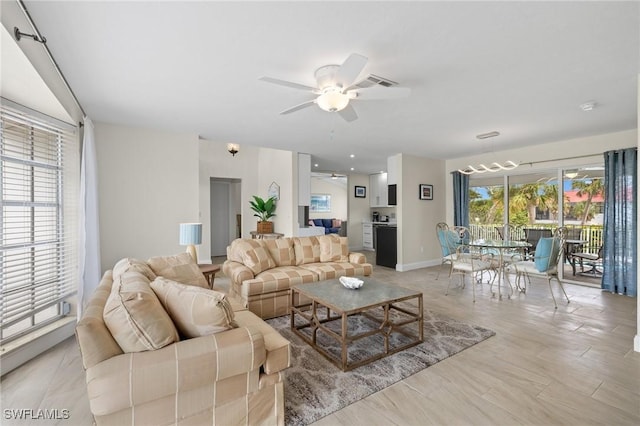 living room featuring ceiling fan