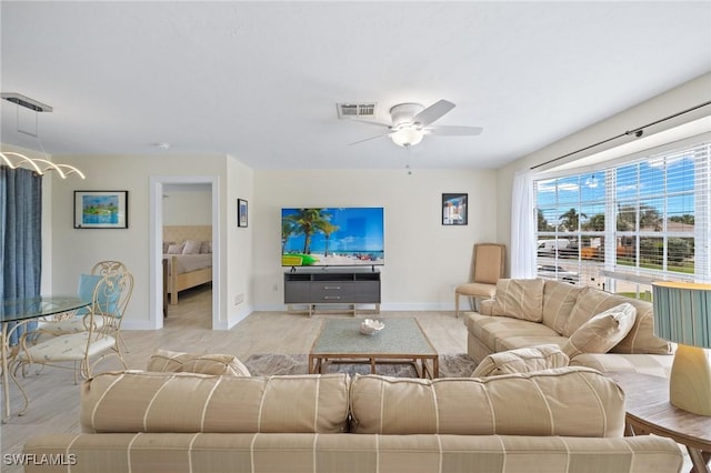 living room with ceiling fan