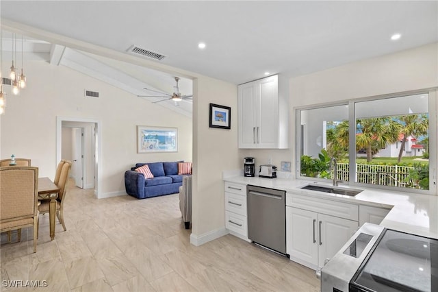 kitchen featuring white cabinets, lofted ceiling with beams, sink, and stainless steel appliances