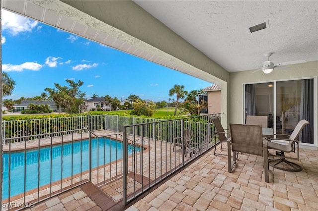 balcony featuring ceiling fan and a patio