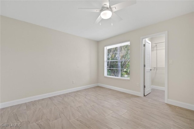 unfurnished room featuring ceiling fan