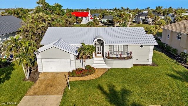 view of front facade with a garage and a front lawn