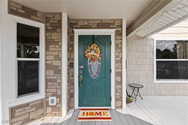 10610 Habitat Trl, Bokeelia, FL 33922 - view of exterior entry with stone siding
