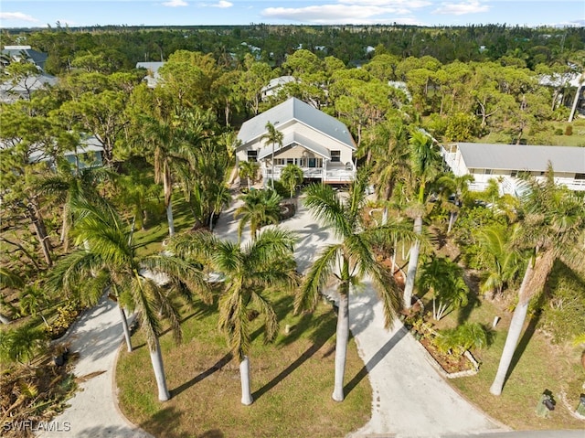 10610 Habitat Trl, Bokeelia, FL 33922 - view of property location featuring a heavily wooded area